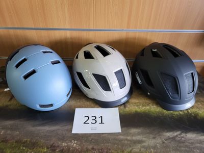 three helmets sitting next to each other on a table