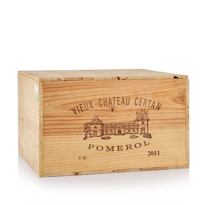a close up of a wooden box with a wine label on it