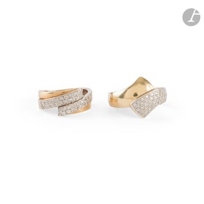 a pair of gold and diamond earrings on a white background