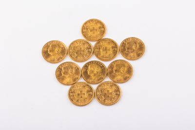 a pile of gold coins on a white surface