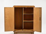 an image of a wooden cabinet with open doors
