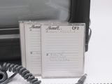 a notepad next to an old television on a desk