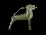 bronze statue of a dog with a leash on a black background