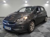 the grey opel is parked in a room with a checkered floor