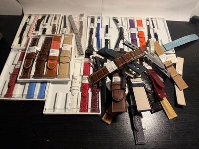 many different types of watches in a case