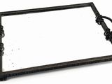 a black tray with a mirror on it on a white surface