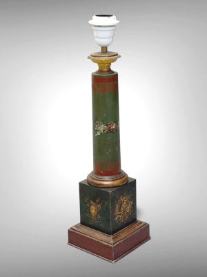 an image of a green and gold column with a white light on top