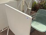 a lot of chairs and a table on the ground