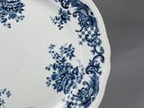 several plates with blue and white designs are stacked on top of each other