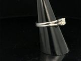 a close up of a silver ring with a flower on it