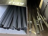 a cardboard box with a bunch of metal rods inside of it
