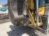 a bulldozer that is parked on the side of the road
