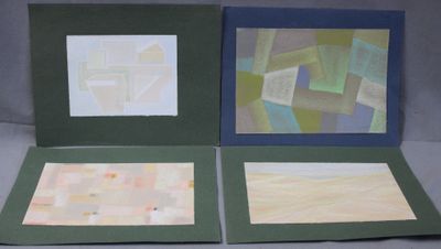 three cards with different designs on them sitting on a table