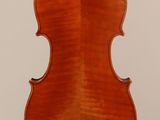 an antique violin with a wooden back and bow