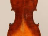 an old violin with a wooden back and a long neck