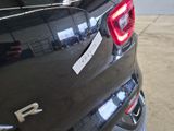 a close up of a car ' s tail light with a sticker on it