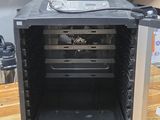 an image of a small open oven on a wooden table