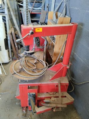 a red machine that is sitting in a room