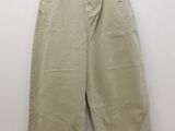an image of a pair of khaki pants hanging on a hanger