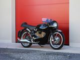 a motorcycle parked in front of a red garage door