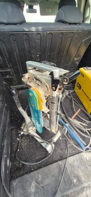 the back of a car with a bunch of wires in the trunk