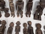 a lot of wooden figurines sitting on a table
