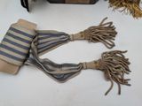 two pieces of cloth and a pair of scissors on a table