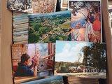 a cardboard box filled with pictures of people and animals