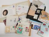 many different types of stamps and envelopes laid out on a table