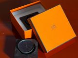 an orange box that has a watch inside of it