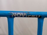a close up of a blue bike frame with the word now pro written on it