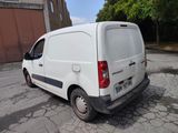 a white van that is parked on the side of the road