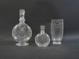 three glass vases sitting next to each other on a table