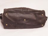 an image of a brown leather bag on a white background