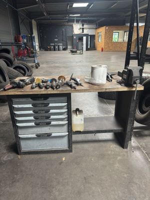 an image of a workbench in a garage with tools