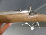 a close up of a hand holding a gun