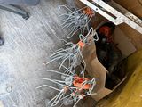 a lot of wires that are hanging from the side of a building