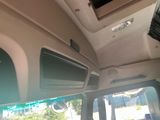 a view of the inside of a vehicle from the driver ' s seat