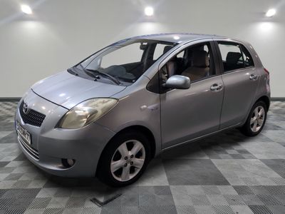 a picture of a small silver car in a room