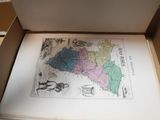 a box with a map inside of it on a table