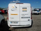 a white van that is parked in a parking lot