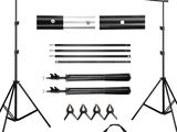 a set of black and white photography backdrops, tripod stands, and accessories