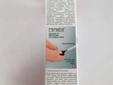 a close up of a box of toothpaste on a white surface
