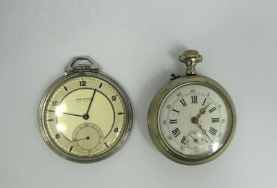 two clocks that are sitting side by side on a table