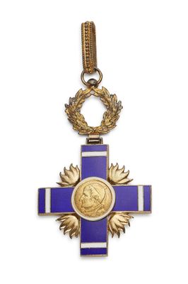 a close up of a cross with a medal on it