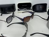 a lot of sunglasses that are sitting on a table