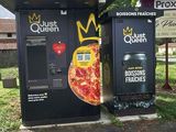 two vending machines that are on the side of the road