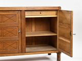 a wooden cabinet with a door open on a white background
