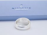 sterling silver ring in a gift box on a white surface