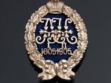 a close up of a badge on a black surface